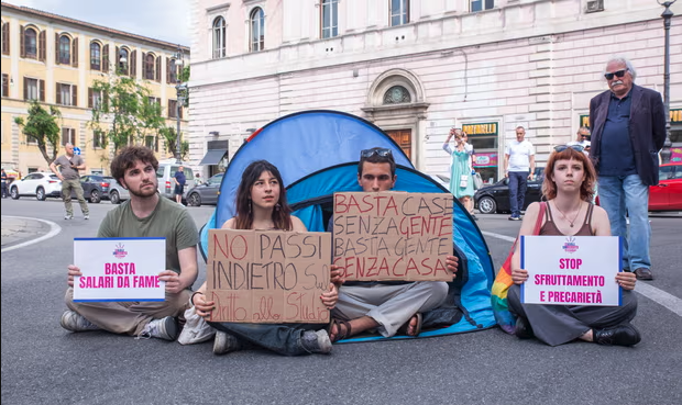 A group of university students in Rome protest against high rents.
